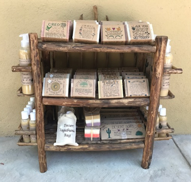 Rustic shelving designed to show off the Desert Soaps line of soaps.