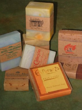 Soaps showing customized labels for various hotels that stock themin the guests rooms.